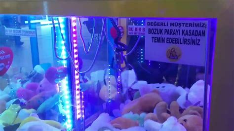 Bozuk parayla çalışan oyuncak yakalama makinesi